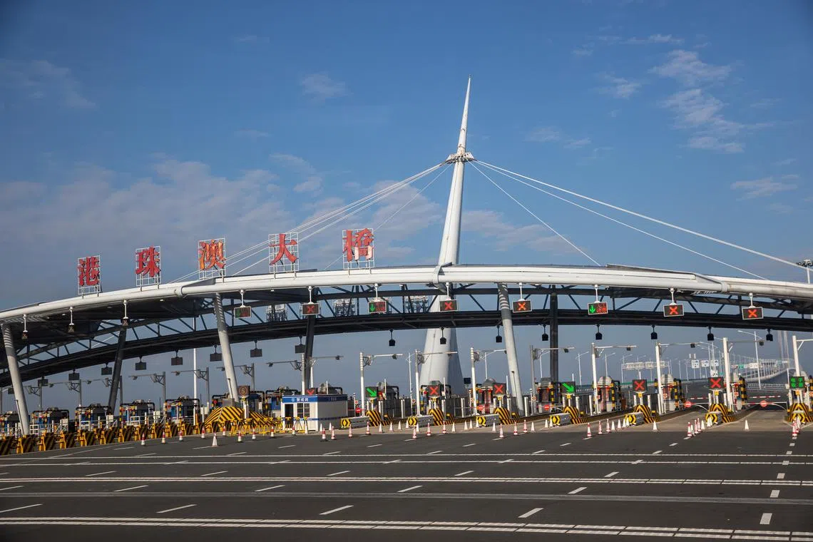Signage indicates the entrance to the Hong Kong-Zhuhai-Macau Bridge in Macau. 