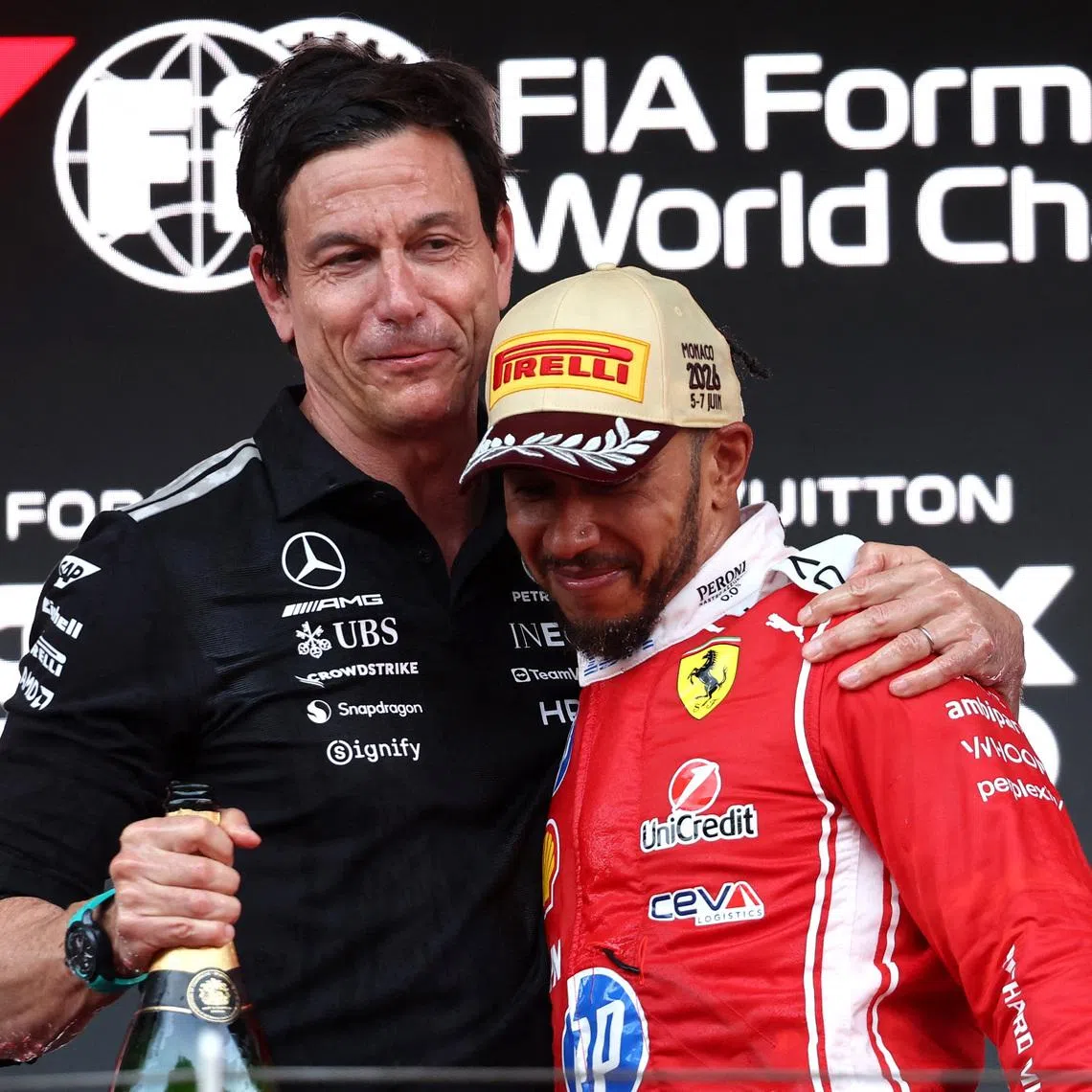 Mercedes team principal Toto Wolff (left) congratulating Ferrari's Lewis Hamilton after his second-place finish at the Monaco Grand Prix on June 7. 