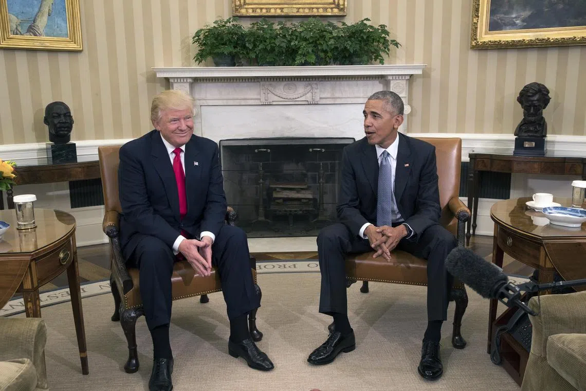 A 2016 photo shows then president Barack Obama (right) meeting president-elect Donald Trump at the White House.