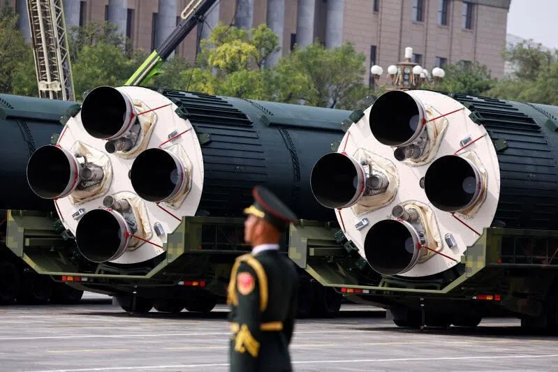 A member of the People's Liberation Army stands as the strategic strike group displays DF-5C nuclear missiles during a military parade in Beijing, China, on Sept 3, 2025.