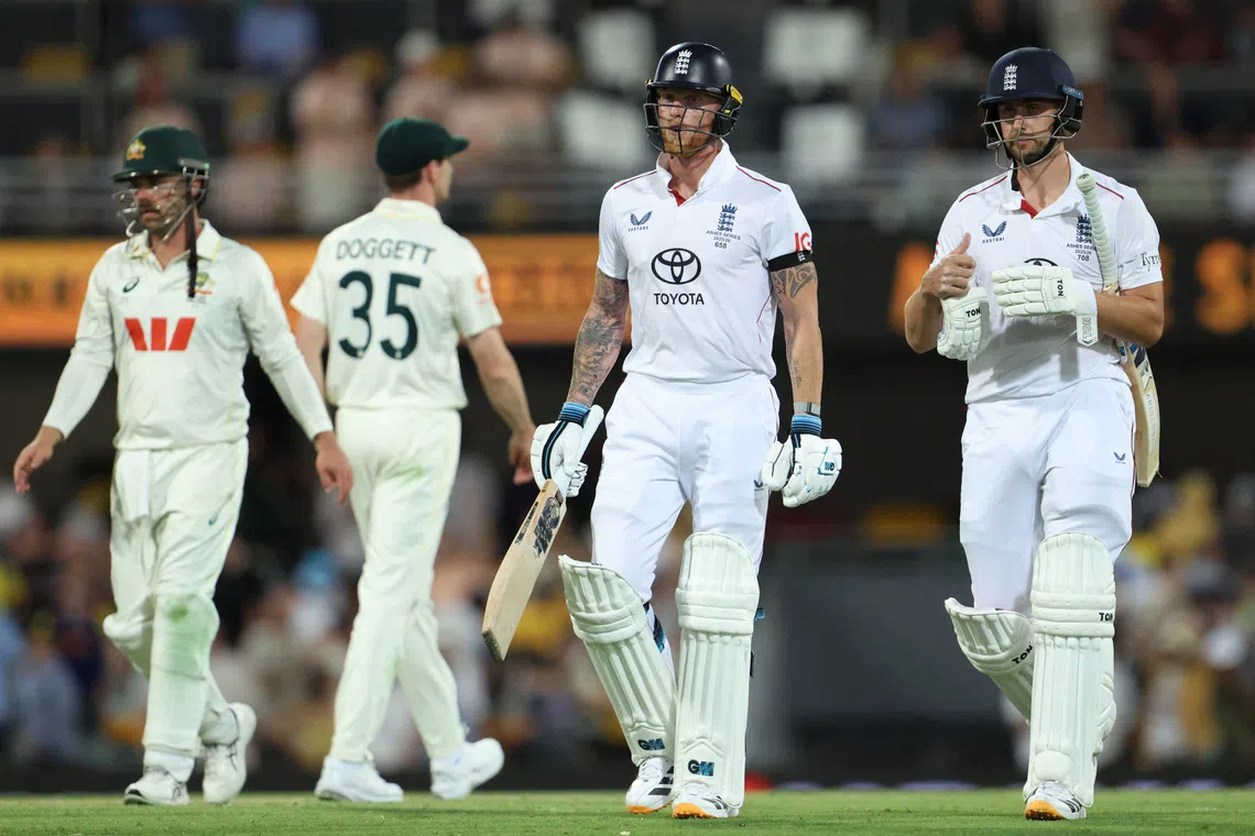 Cricket - The Ashes - Australia v England - Second Test - The Gabba, Brisbane, Australia - December 6, 2025 England's Ben Stokes and Will Jacks look dejected at stumps on day 3 REUTERS/Hollie Adams
