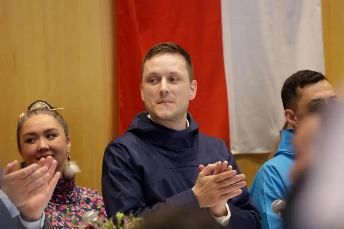 Leader of the Democrats (Demokraatit) party and Greenland's Prime Minister-elect Jens-Frederik Nielsen reacts during a ceremony to sign a coalition agreement, in Nuuk, Greenland, March 28, 2025. REUTERS/Leonhard Foeger