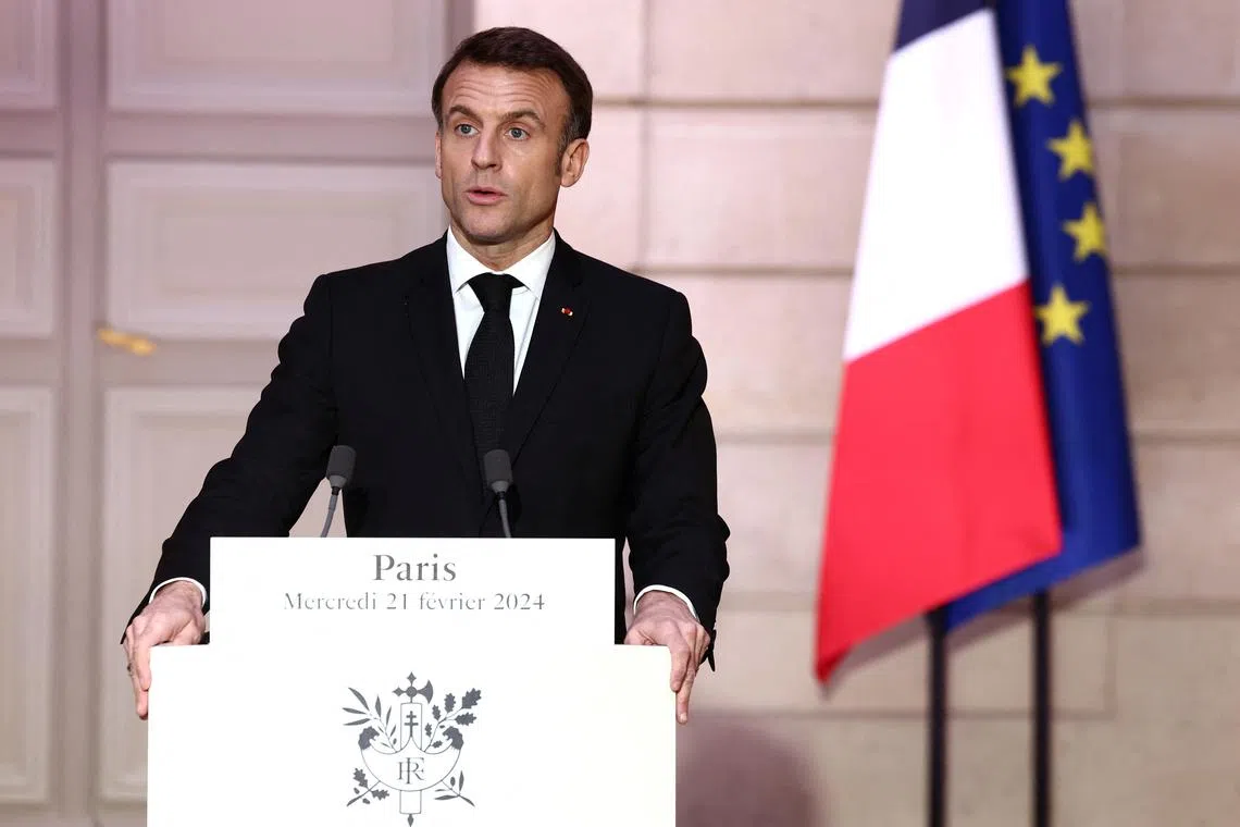 French President Emmanuel Macron speaks during a joint press conference with Armenian Prime Minister Nikol Pashinyan (not seen) as part of a meeting on the sidelines of the entry ceremony for Missak Manouchian and his resistance comrades into the Pantheon, at the Elysee Palace in Paris, France, February 21, 2024. REUTERS/Stephanie Lecocq/Pool
