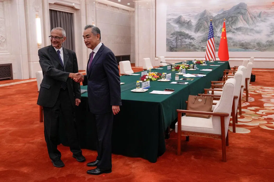 White House Senior Advisor for Clean Energy John Podesta shakes hands with China's Foreign Minister Wang Yi on the day of their meeting at the Great Hall of the People in Beijing, China September 6, 2024.     Andy Wong/Pool via REUTERS