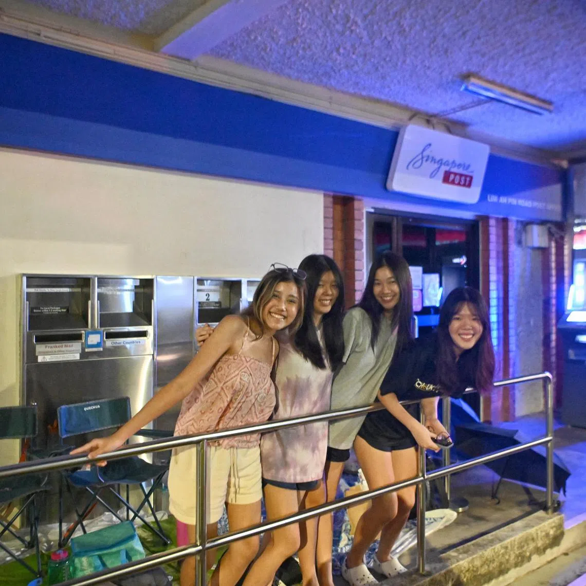 Former secondary school friends, (from left) Nellie Titus, 18, Rebekah Loh, 18, Megan Choy, 18 and Lynette Saw, 18, at the Lim Ah Pin Post Office on July 5, 2023. ST PHOTO: Ariffin Jamar