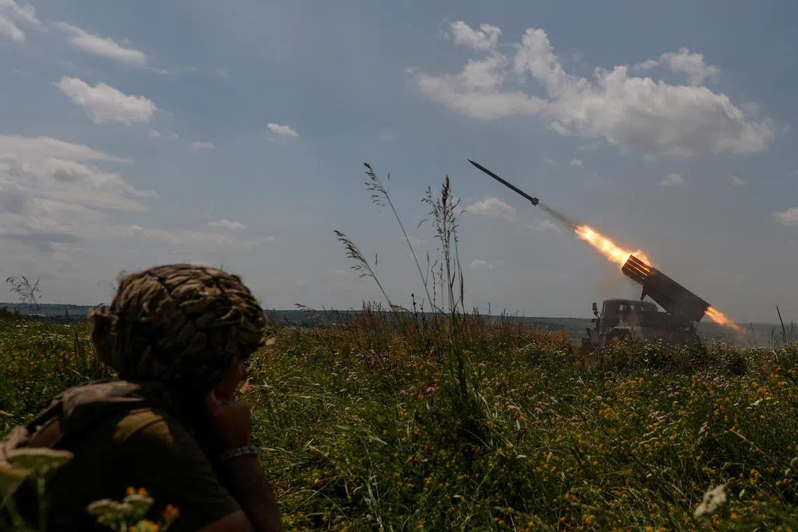 Ukrainian servicemen fire a BM-21 Grad multiple launch rocket system towards Russian troops near a front line in Zaporizhzhia on June 25.