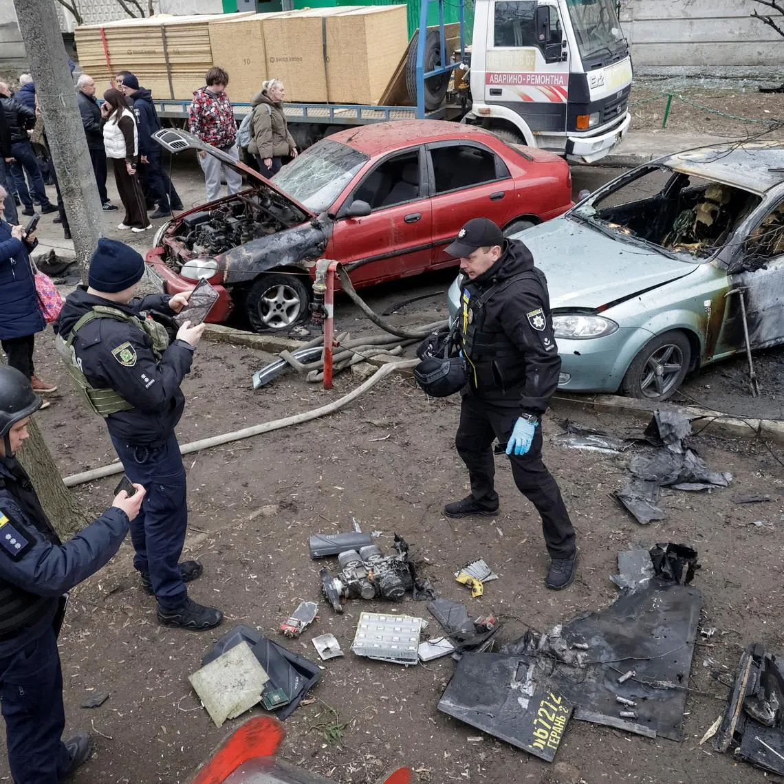 Police experts work at the site of a Russian drone strike, amid Russia's attack on Ukraine, in Kharkiv, Ukraine March 25, 2026.  REUTERS/Sofiia Gatilova