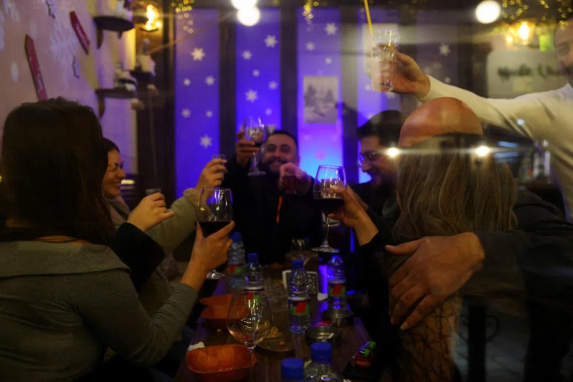 People enjoying a night out in the Bab Touma neighbourhood of the Old City of Damascus, after the ousting of President Bashar al-Assad in 2024.