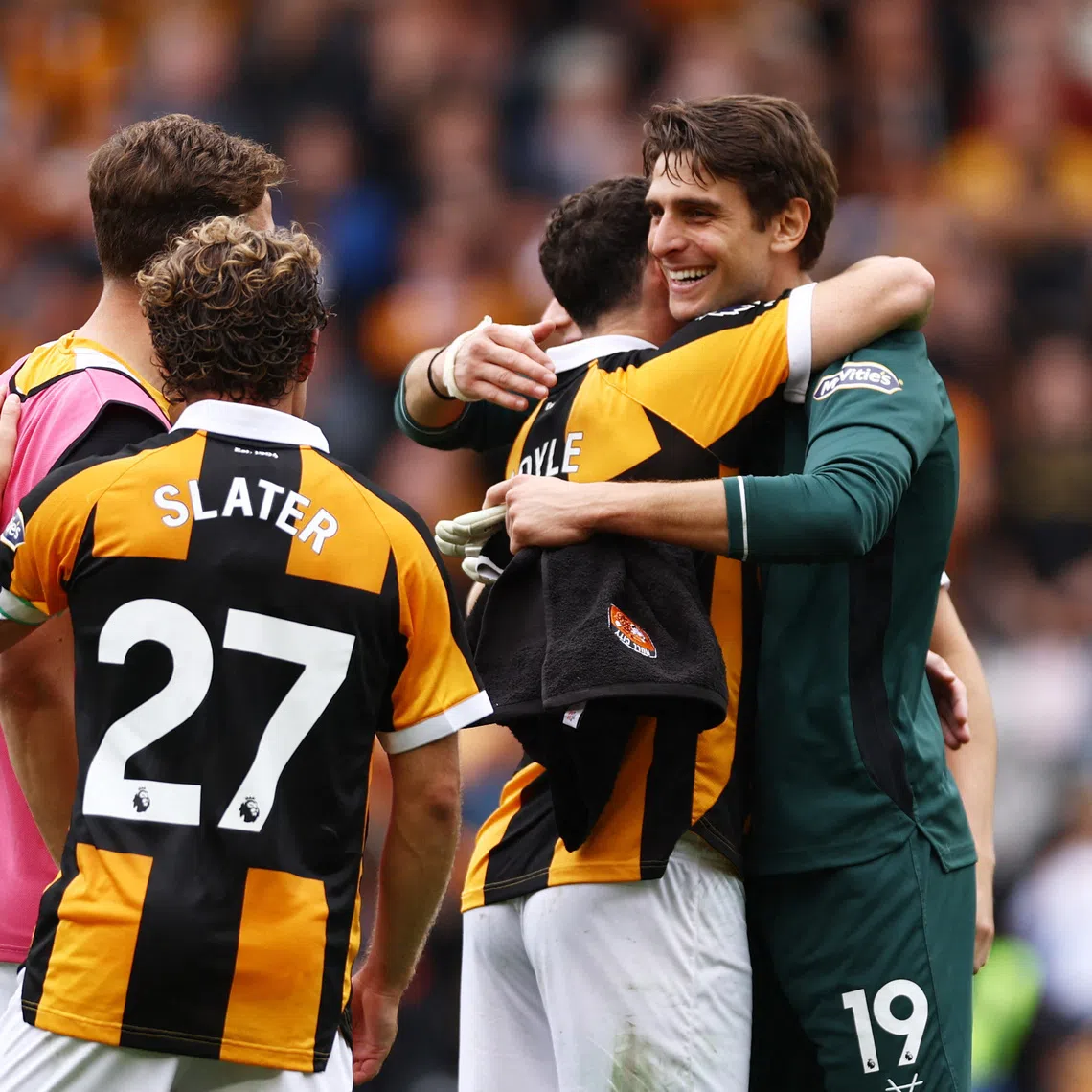 Soccer Football - Premier League - Hull City v Manchester United - MKM Stadium, Hull, Britain - August 22, 2026 Hull City's Konstantinos Tzolakis and Lewie Coyle celebrate after the match Action Images via Reuters/Lee Smith