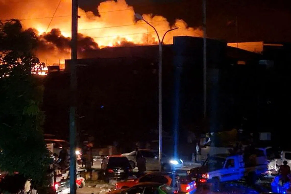 FILE PHOTO: People take part in looting and arson during protests over a pay cut for police that officials blamed on an administrative glitch, in Port Moresby, Papua New Guinea January 10, 2024 in this screen grab obtained from social media video. Leo Manuai/via REUTERS/FILE PHOTO