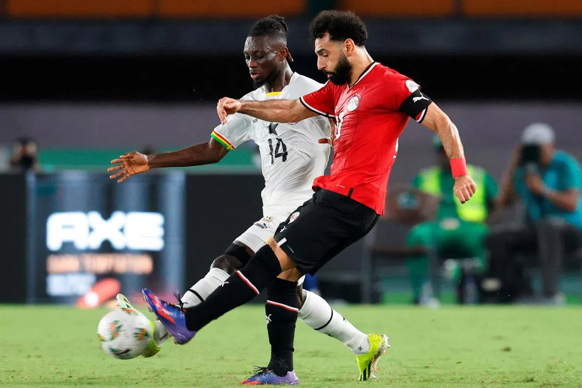 Egypt's Mohamed Salah (right) in action with Ghana's Gideon Mensah during the Africa Cup of Nations, on Jan 18.