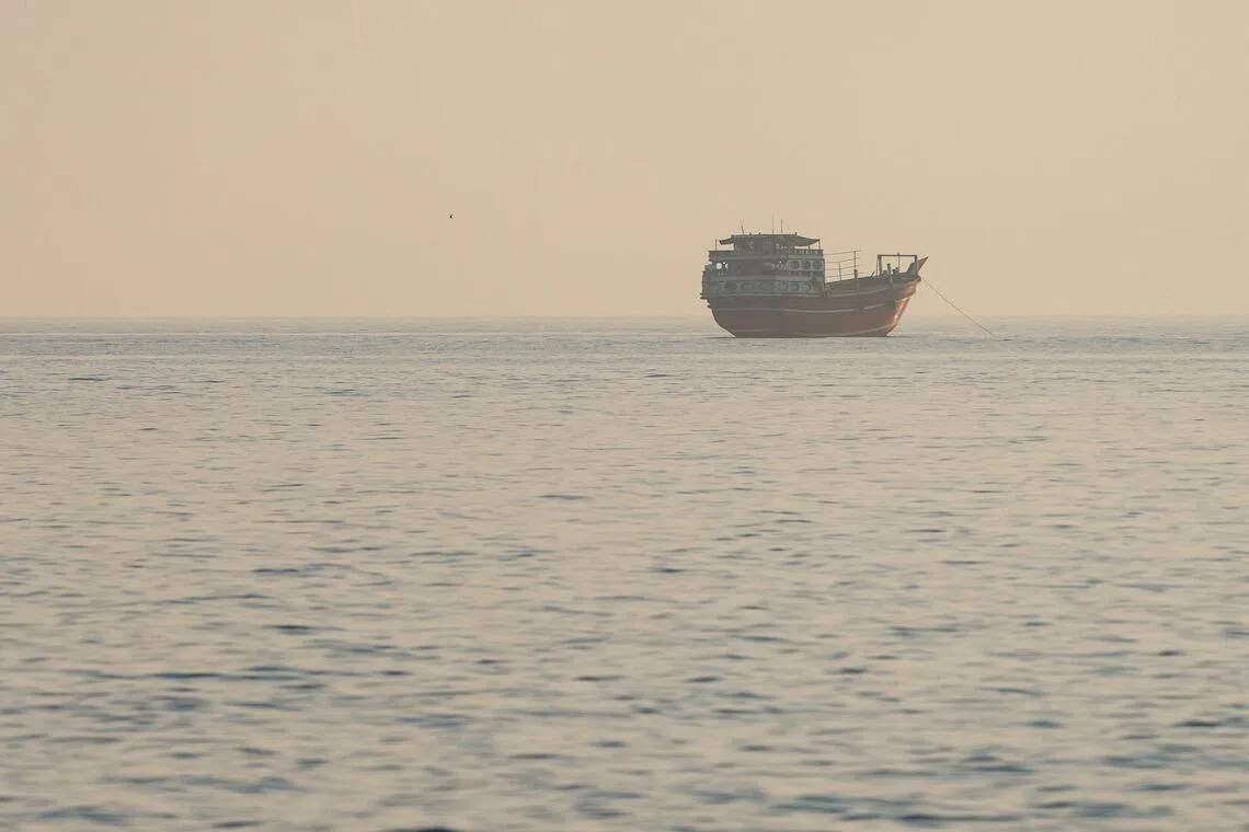 A vessel at the Strait of Hormuz, as seen from Musandam, Oman, July 28, 2026. REUTERS/Stringer