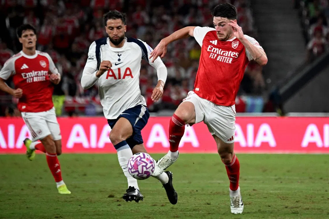 Arsenal’s Declan Rice (right) and Tottenham Hotspur's Rodrigo Bentancur fighting for the ball during their friendly in Hong Kong on July 31.