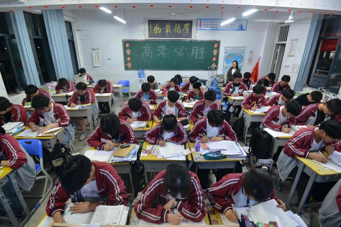 High school students prepare for the National College Entrance Examination, known as "gaokao", in Fuyang in eastern China's Anhui province, on May 27.