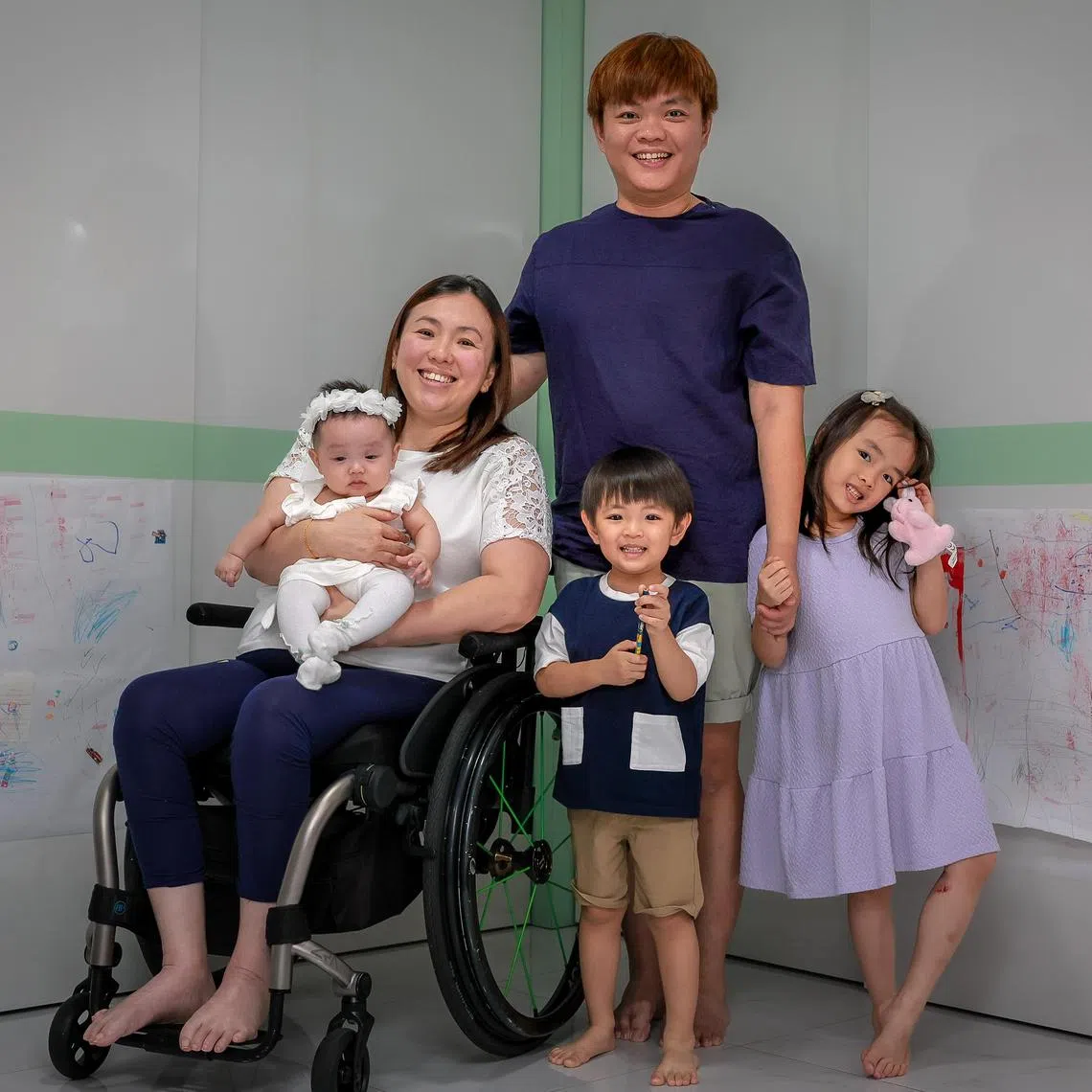 Jean Ling with her husband Jake Oh and their three children Summer, 6,  Evan, 2, and Adel, 5 months, in their home on June 23, 2025.