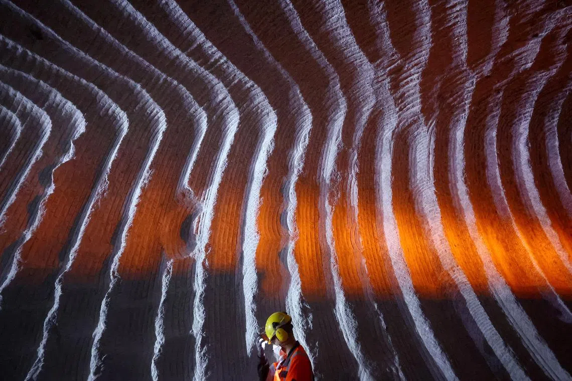 A miner seen in a salt mine where construction is underway to build the 700 km long SuedLink electric power line to transport 'green energy' from wind turbines from the northern coast to the country's south at the Suedwestdeutsche Salzwerke salt mine in Heilbronn, Germany, Sept 12.
