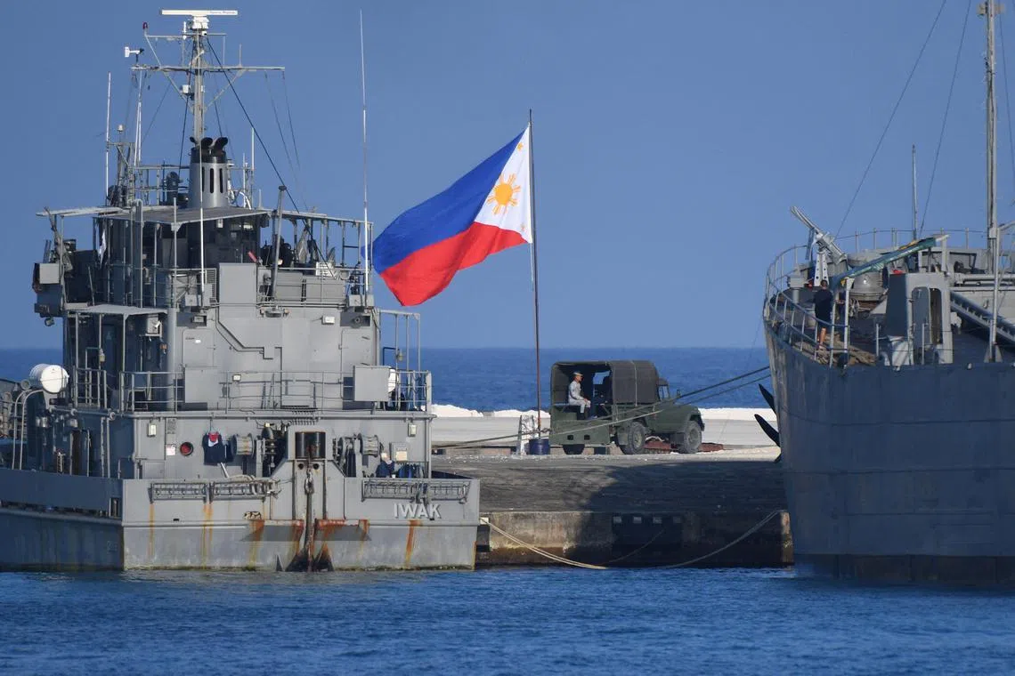 Philippine navy ships dock at an island in disputed waters in the South China Sea.