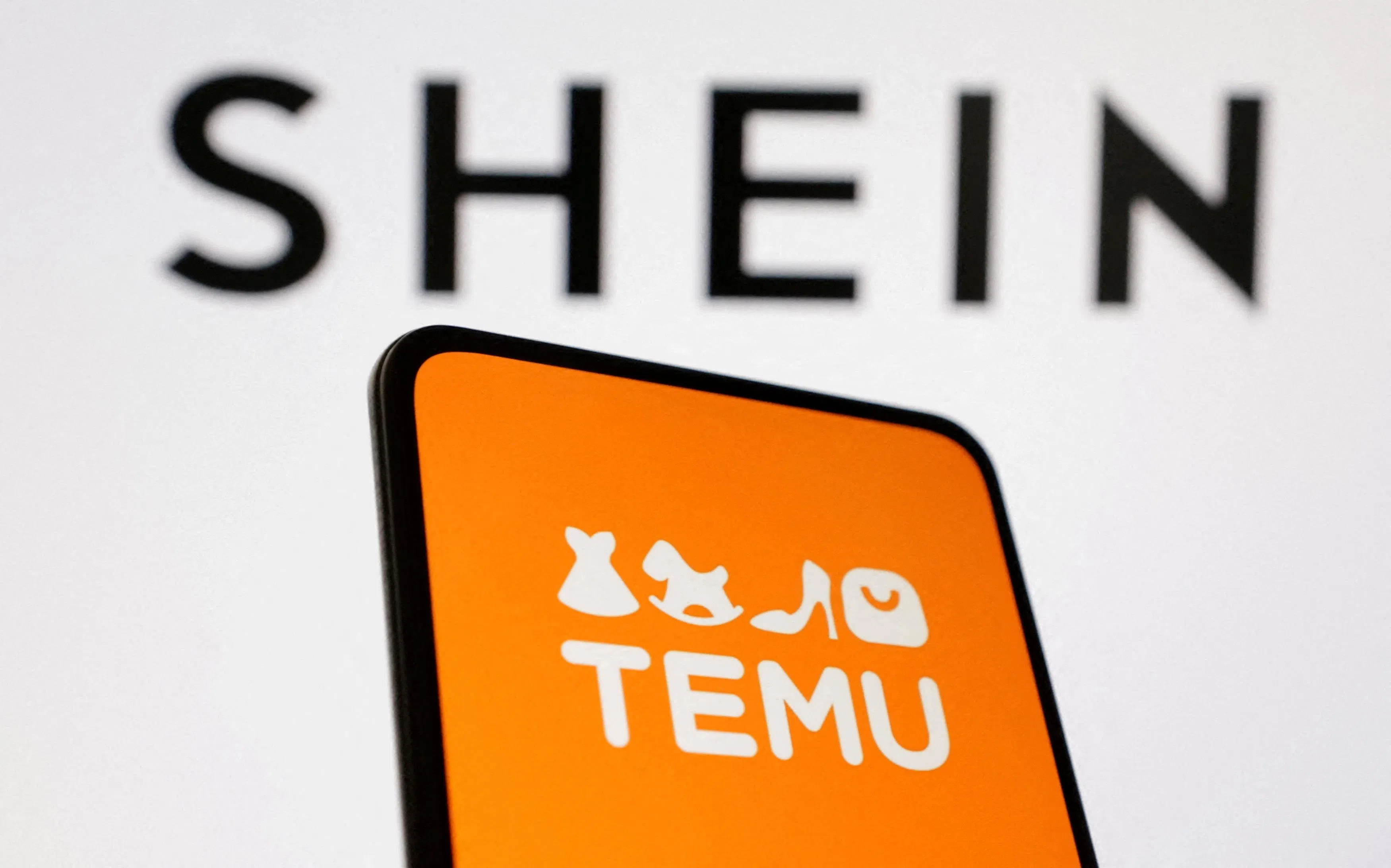 FILE PHOTO: Shein and Temu logos are seen in this illustration taken August 22, 2024. REUTERS/Dado Ruvic/Illustration/File Photo