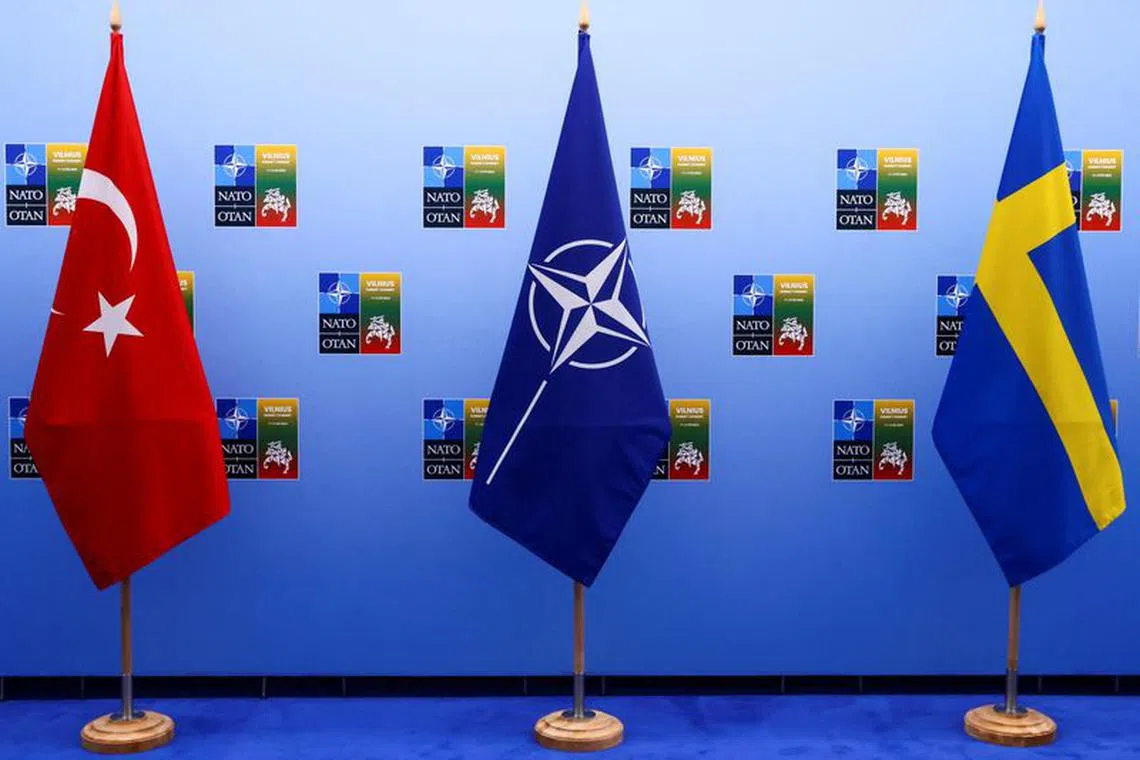 Turkish, NATO and Swedish flags stand on the day of a meeting between Turkish President Tayyip Erdogan and Swedish Prime Minister Ulf Kristersson on the eve of a NATO summit, in Vilnius, Lithuania July 10, 2023. REUTERS/Yves Herman/Pool/File Photo