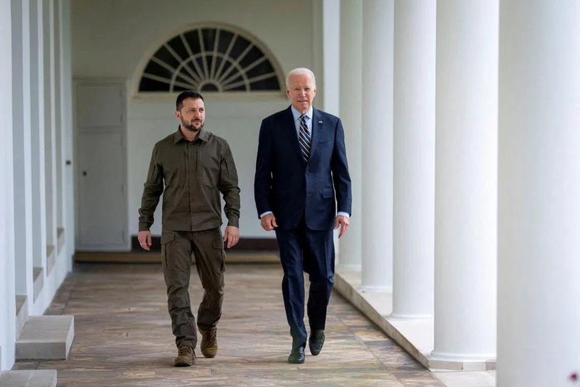 FILE PHOTO: Ukrainian President Volodymyr Zelenskiy walks down the White House colonnade to the Oval Office with U.S. President Joe Biden during a visit to the White House in Washington, U.S., September 21, 2023. Doug Mills/Pool via REUTERS/File Photo
