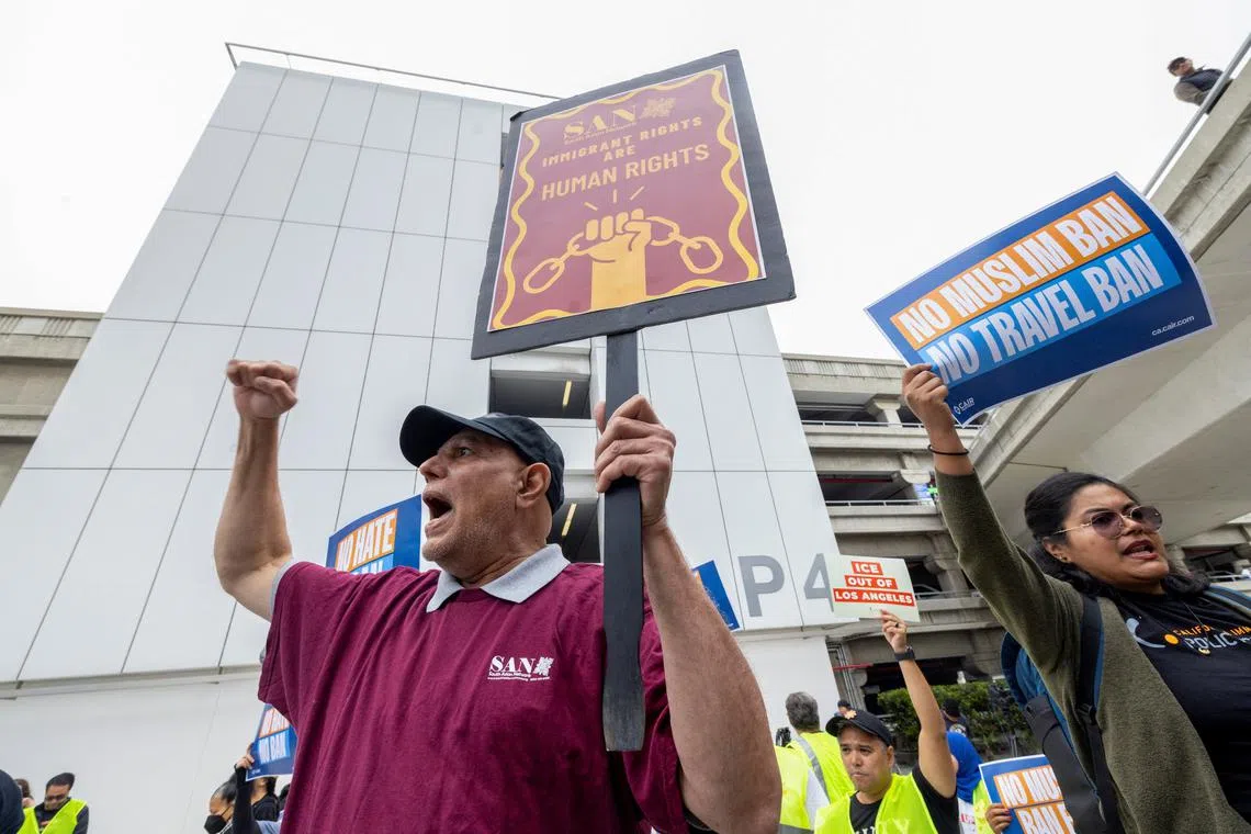 People take part in a protest sponsored by the Council on American Islamic Relations (CAIR) against U.S. President Donald Trump's new sweeping travel ban, which went into effect as his administration intensifies its immigration crackdown, at Los Angeles International Airport (LAX) in  Los Angeles, California, U.S., June 9, 2025.   REUTERS/Jill Connelly
