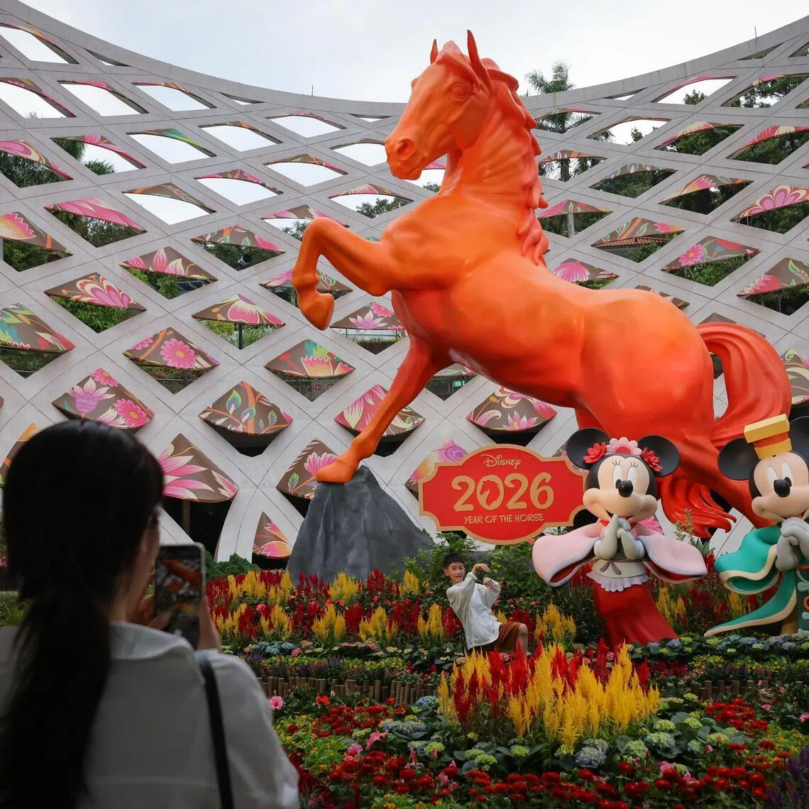 A preview of The Protector at Sentosa Sensoryscape's Tactile Trellis featuring:
•  8-metre Celestial Guardian Yanyang
• 2.5-metre Disney’s Mickey Mouse and Minnie Mouse figures
• Mini-garden layout with festive blooms featuring Celosia flowers