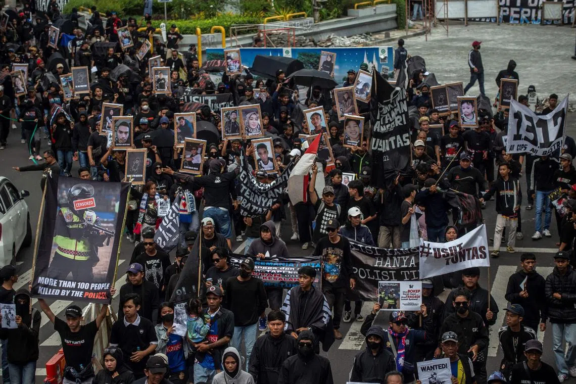 Protesters marched on the main thoroughfare of the city of Malang, and called for the tragedy to be deemed a gross human rights violation.