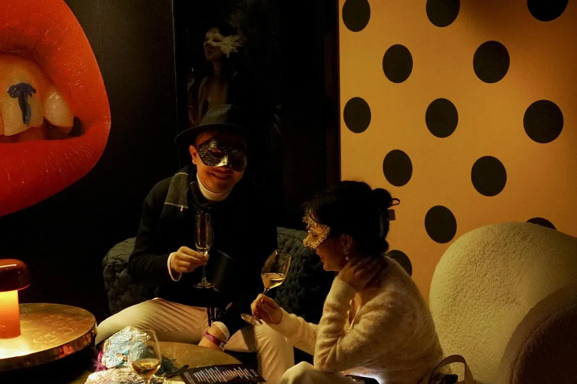 People attend a masquerade singles mixer in Shanghai, China on Jan 13.