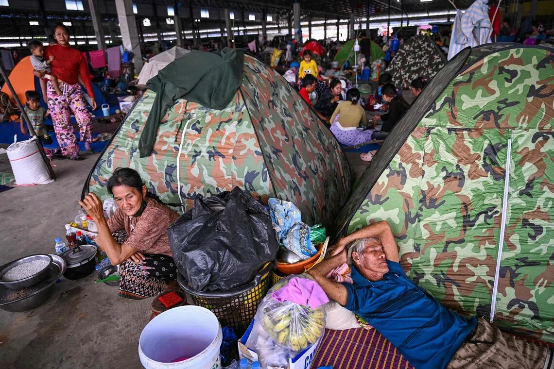 Displaced residents rest at a temporary camp in Cambodia's Banteay Meanchey province on Dec 14, 2025, amid clashes along Cambodia-Thailand border.