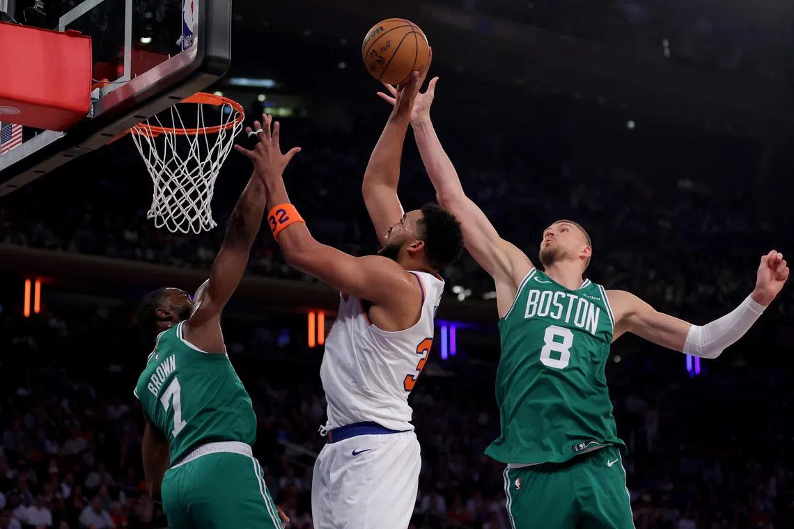 Boston Celtics centre Kristaps Porzingis blocks a shot by New York Knicks centre Karl-Anthony Towns in last season's NBA play-offs.
