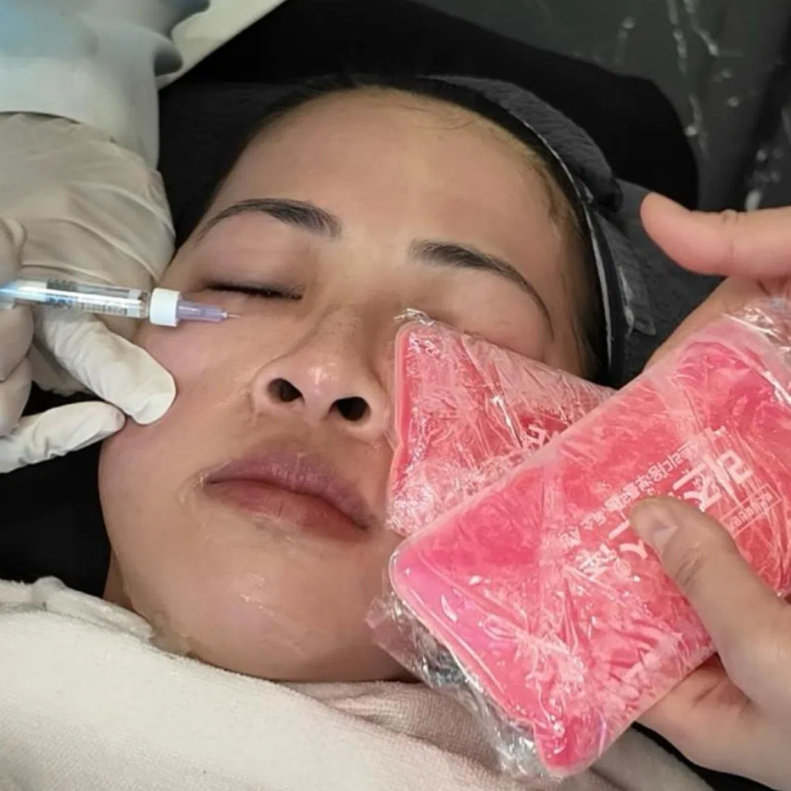 Ms Caitlin Lim getting fillers injected in her under-eye area at a aesthetic clinic. 