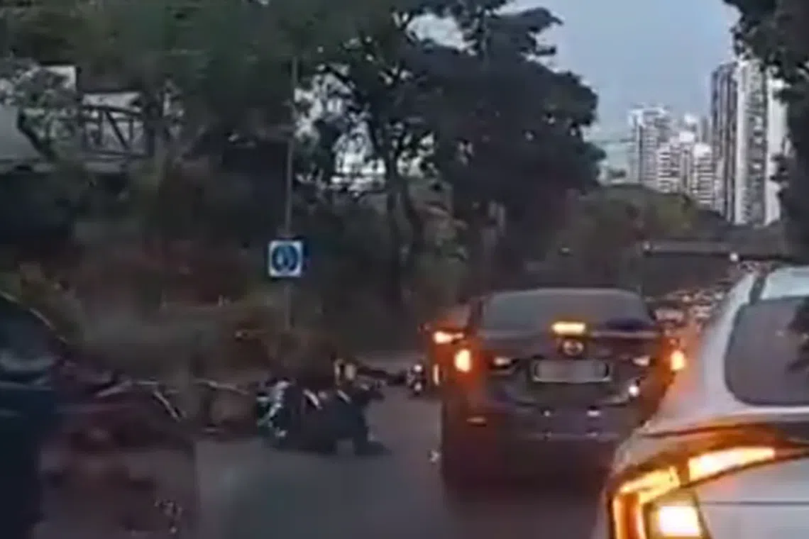 A black car, who was on the rightmost lane, can be seen crashing into a group of motorcyclists while trying to change lane. 