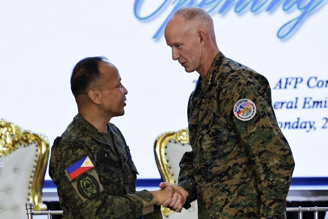 Philippine Army Major-General Francisco Lorenzo Jr (left) and US Marine Corps Lieutenant-General James Glynn shaking hands after the opening ceremony for the annual Balikatan military drills, on April 21.