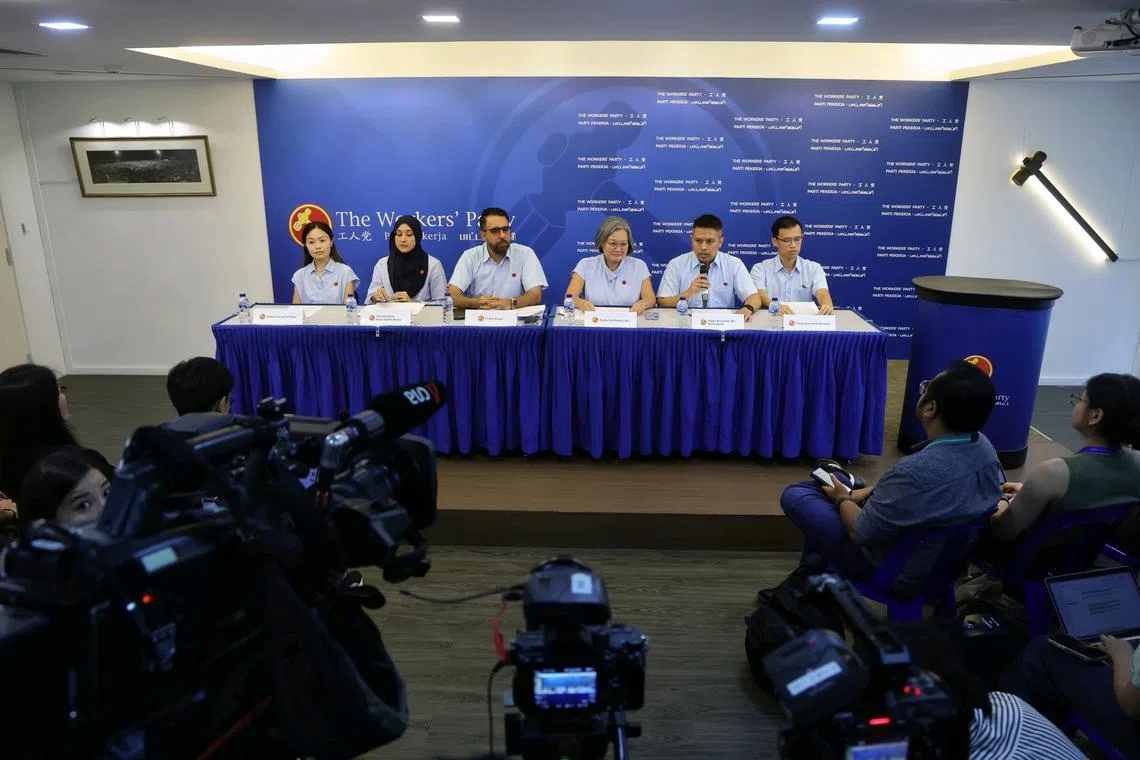 Workers' Party chief Pritam Singh (centre, left) and chairman Sylvia Lim (centre, right) with the party's new faces (from left) Eileen Chong, Siti Alia Abdul Rahim Mattar, Abdul Muhaimin Abdul Malik and Kenneth Tiong.