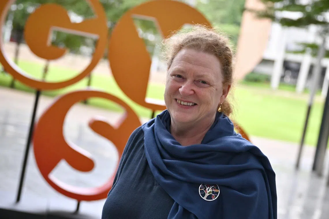 Professor Sue Black studies the back of the hand to look into a person’s past.