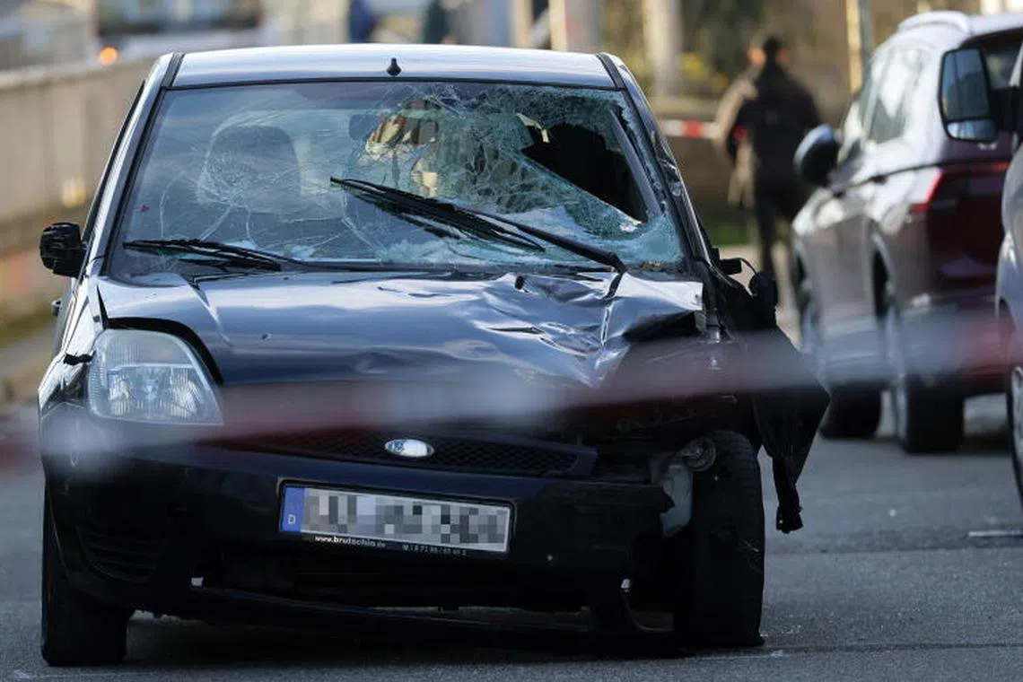 Caption:
epa11938267 A damaged car at the crime scene after a vehicle was driven into pedestrians in Mannheim, Germany, 03 March 2025. According to statements from police, a vehicle drove into a crowd in the Mannheim city centre, killing one person and injuring several others. EPA-EFE/RONALD WITTEK