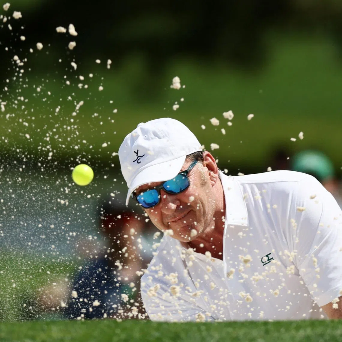 Golf - The Masters - Augusta National Golf Club, Augusta, Georgia, U.S. - April 10, 2024 England's Nick Faldo plays out from the bunker on the 2nd hole during the par 3 contest REUTERS/Eloisa Lopez