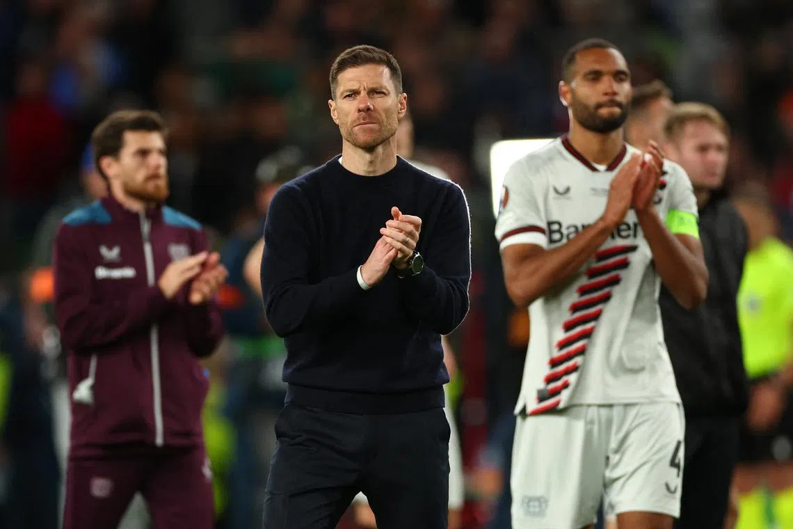 Soccer Football - Europa League - Final - Atalanta v Bayer Leverkusen - Aviva Stadium, Dublin, Ireland - May 22, 2024 Bayer Leverkusen coach Xabi Alonso looks dejected as he applauds fans after losing the Europa League final REUTERS/Andrew Boyers