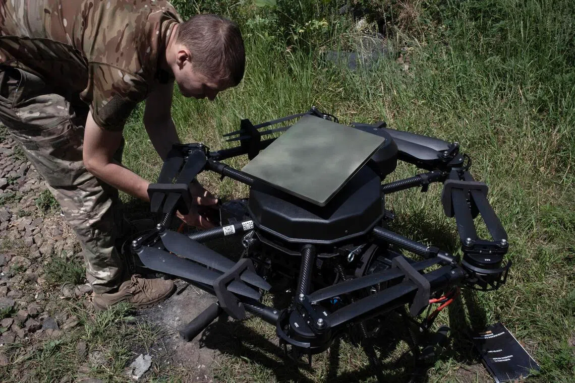 epa13068811 A Ukrainian drone operator installs a Starlink communications system on a 'Vampiro' attack drone that is due to carry out a mission at an undisclosed location near the frontline in the Donetsk region, eastern Ukraine, 26 June 2026 (issued 27 June 2026), amid the Russian invasion. Ukrainian military units frequently modify their unmanned aerial vehicles in real time to adapt to changing electronic warfare conditions on the battlefield.  EPA/MARIA SENOVILLA