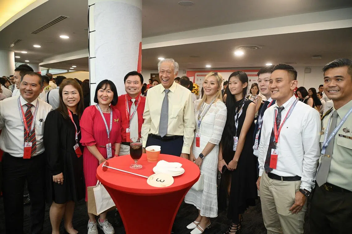 Minister for Defence Ng Eng Hen (centre) with principal partners at an NDP appreciation function at Gardens by the Bay, on Aug 17.