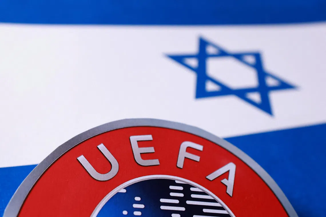 Israeli flag and UEFA logo are seen in this illustration taken September 30, 2025. REUTERS/Dado Ruvic/Illustration
