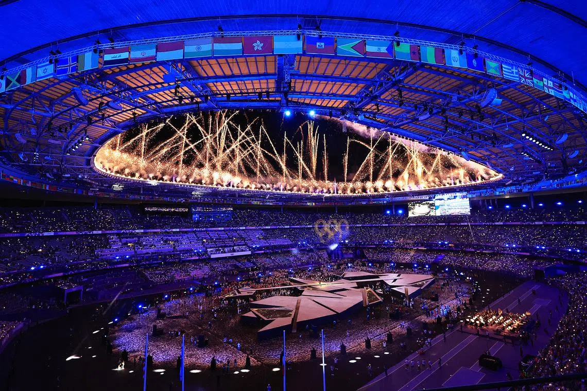 French singer Yseult performing at the closing ceremony of the Paris Olympics as fireworks go off above the Stade de France on Aug 11, 2024.