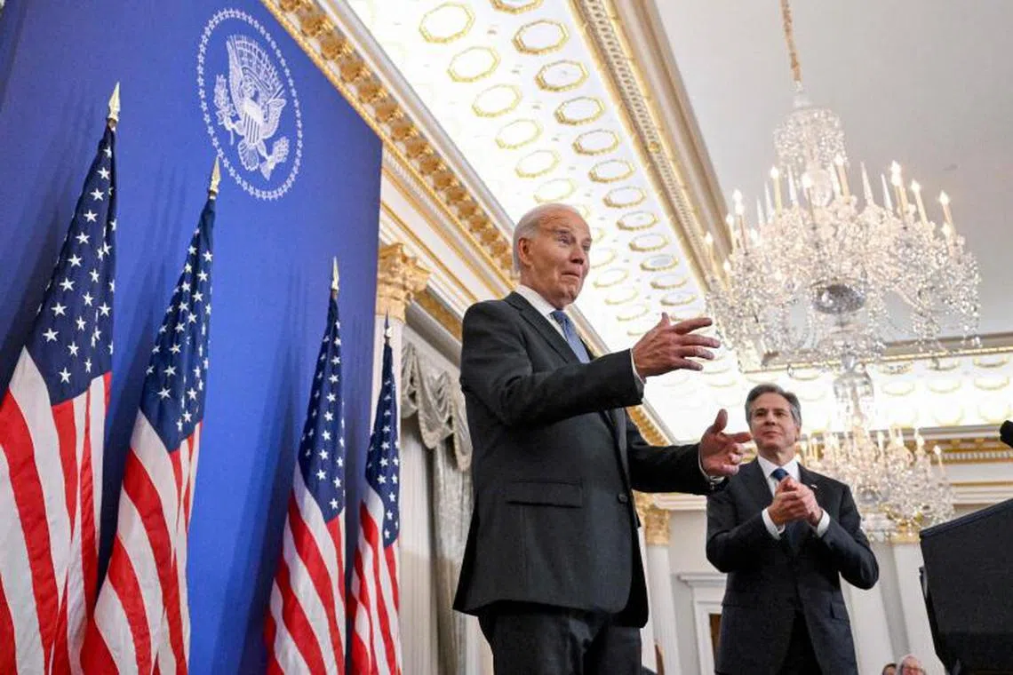US President Joe Biden reacts to applause as he arrives to speak at the State Department in Washington, DC, on January 13, 2025, as he delivers his final foreign policy speech. (Photo by ROBERTO SCHMIDT / AFP)