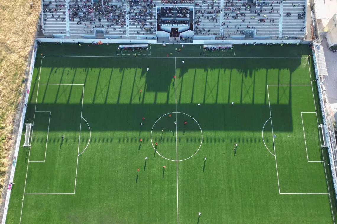 An aerial picture showing a football match between Jordan and Palestine during the inauguration of the newly-renamed Pele Stadium in al-Khader village in Bethlehem, on May 14.