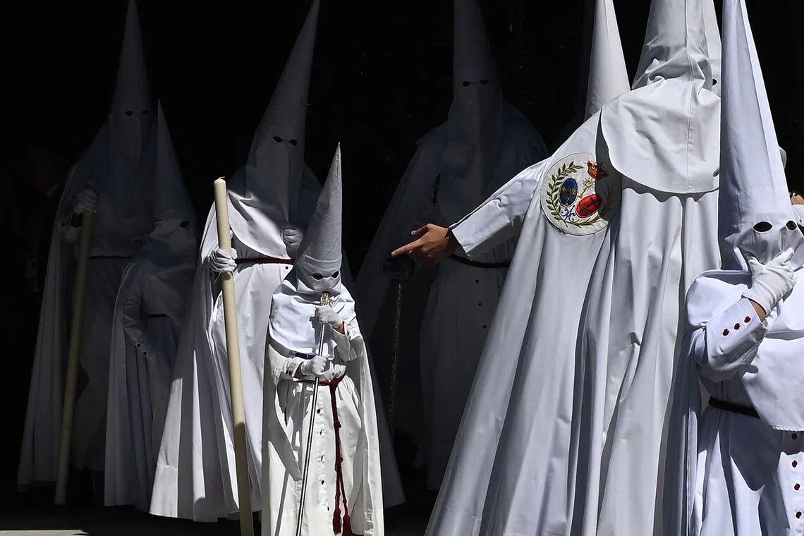 Penitents from the La Paz brotherhood parade in the Palm Sunday procession in Seville, Spain on March 29, 2026. 