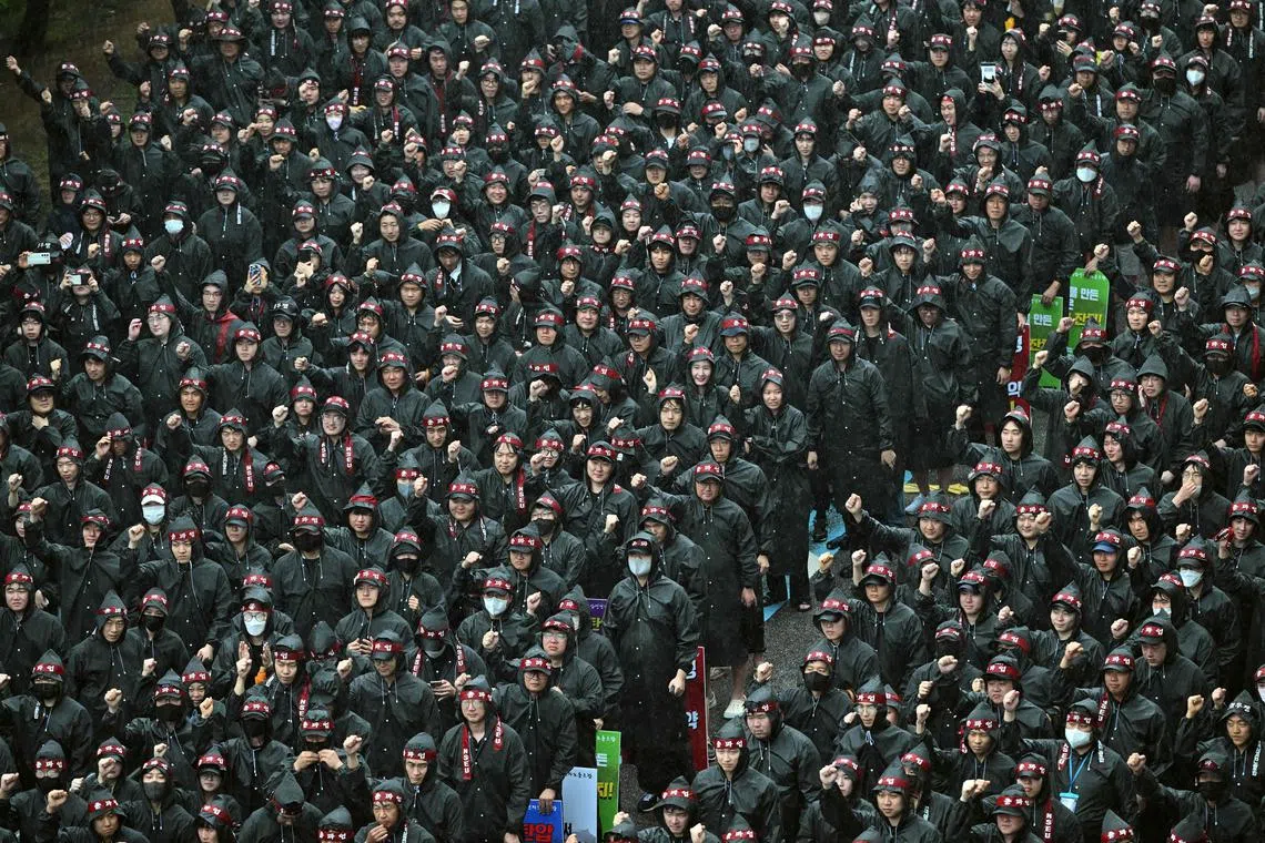 Members of the National Samsung Electronics Union stage a rally as they begin a three-day strike in Hwaseong on July 8. 