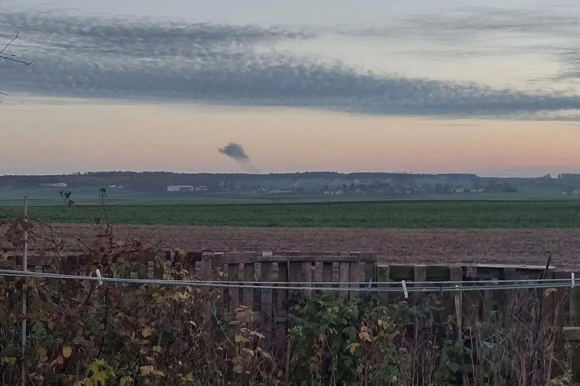Smoke rises in the distance, seen from Nowosiolki, Poland, amid reports of Russian rockets landing near Poland's border with Ukraine.