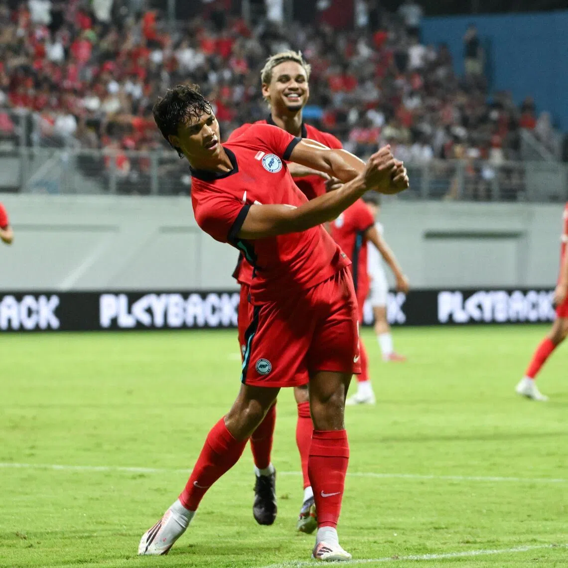 Ikhsan Fandi celebrating with his brother Irfan Fandi after scoring in Singapore’s 4-0 friendly win over Mongolia on May 31.