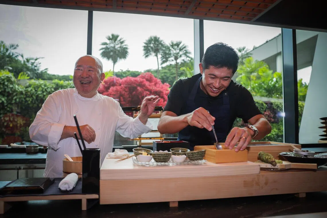 Renowned chef Tetsuya Wakuda (left) and PGA Tour player Collin Morikawa during a culinary contest at Wakuda Singapore restaurant on Oct 17.