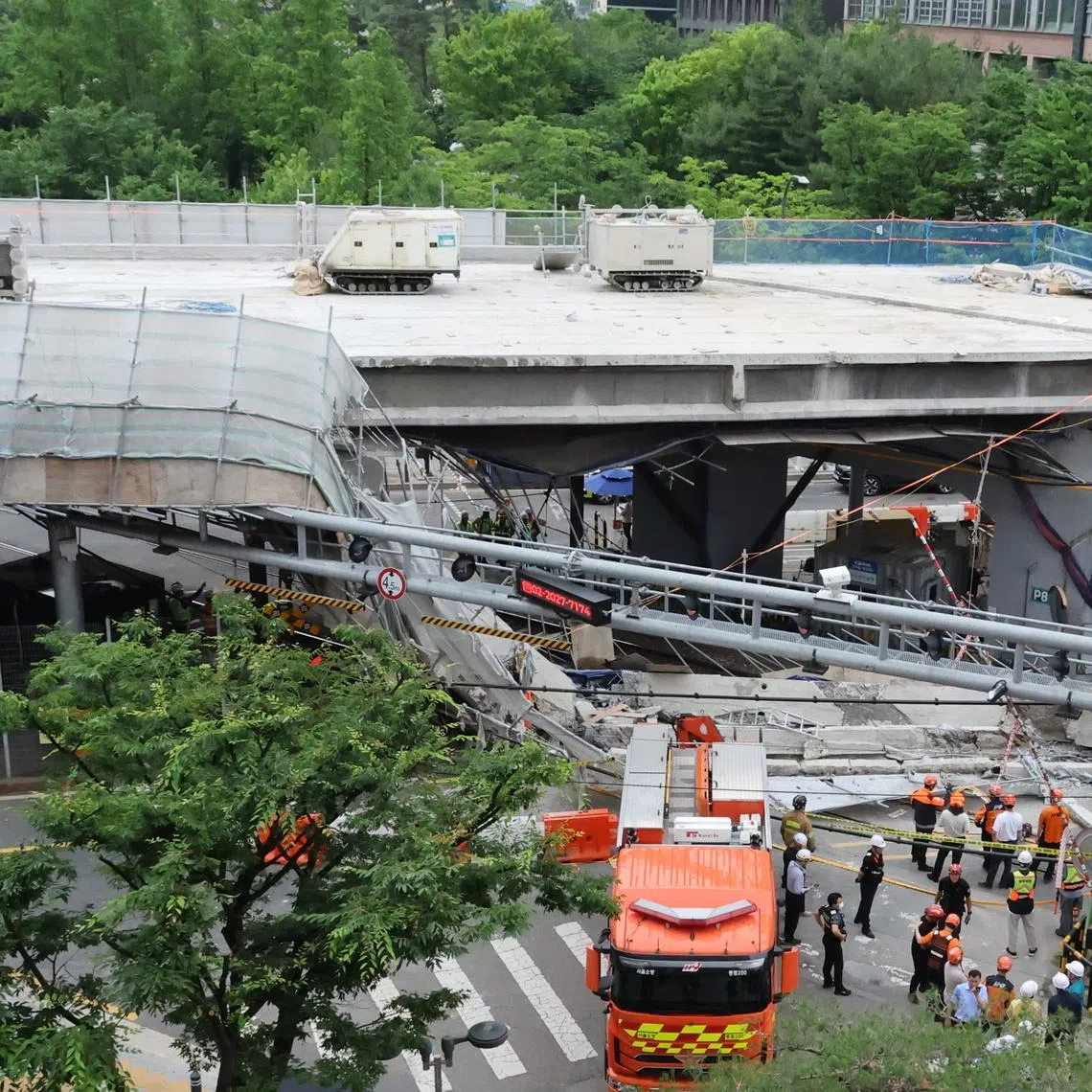 Search and rescue operations are under way at the site of an overpass collapse in western Seoul, on May 26.
